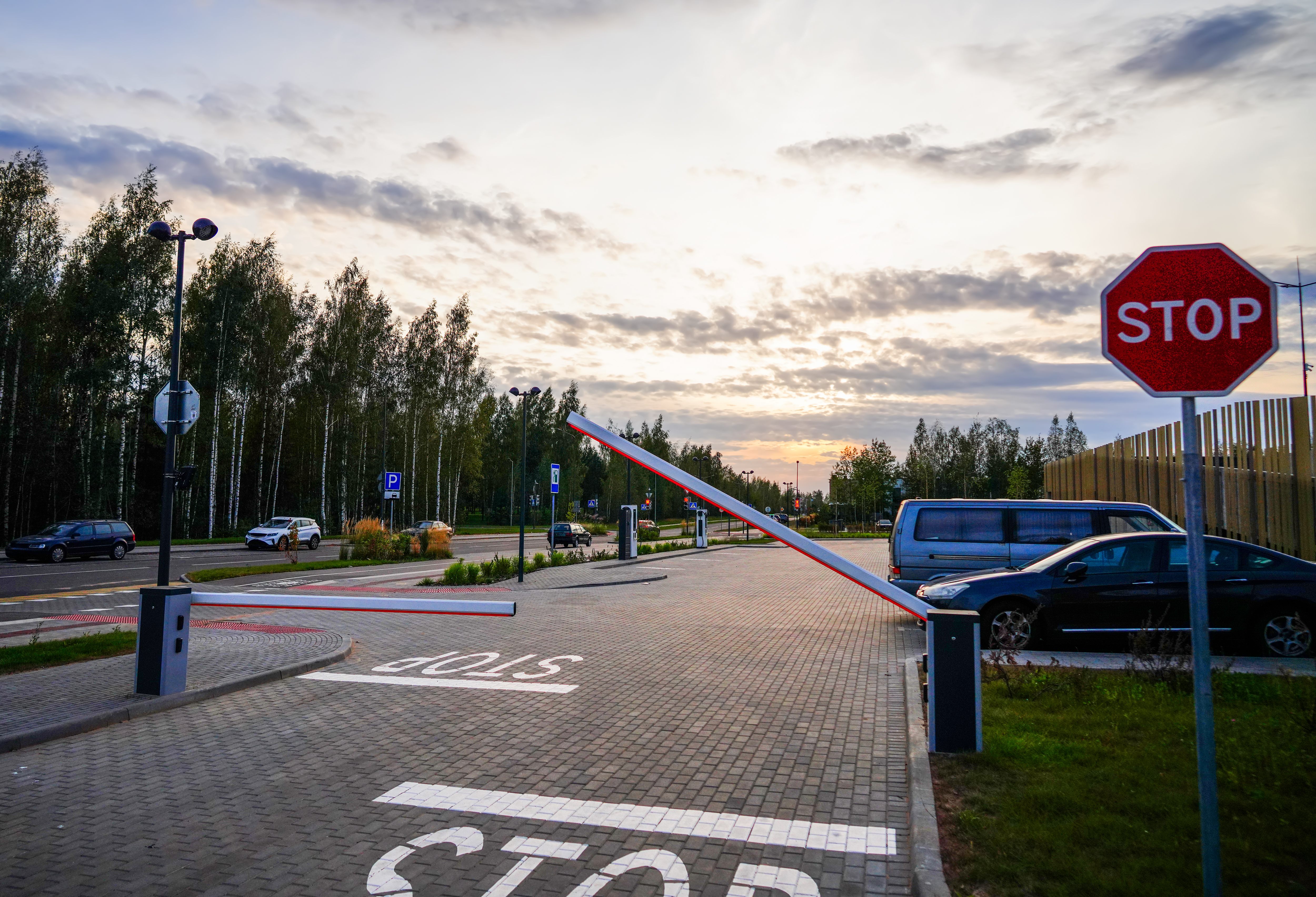 Barrier at exit of parking lot. Automatic car barrier in Private urbanization residential area. Barrier Gate on parking lot. Barrier for entry and exit to parking lot for residents of area.